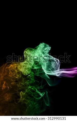 Movement of smoke, Abstract colorful smoke on white background, smoke background,colorful ink background,Violet  Green and Orange smoke