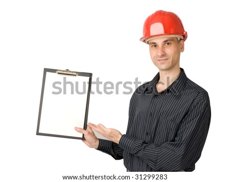 The young man in a red building helmet holding a sheet of paper in a hand
