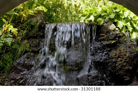 Small artificial waterfall in the park.