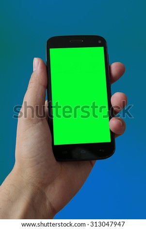 symbolic image: smartphone, mobile telephone with an isolated green screen.
