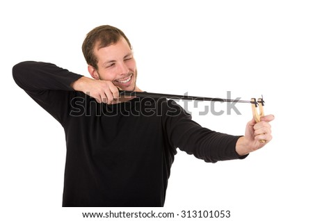 Hansome man concentrated aiming a slingshot isolated over white background.