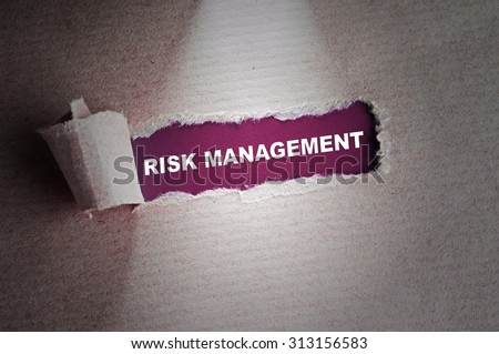 Torn paper with word Risk Management