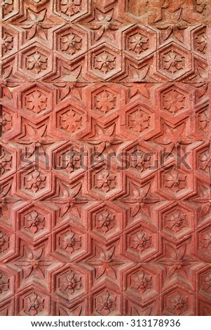 Decorative sandstone wall of Qutub Minar, Delhi, India.