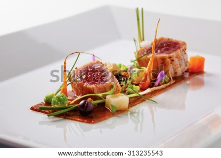 Yellow fin tuna with fresh vegetables and soya sauce Royalty-Free Stock Photo #313235543