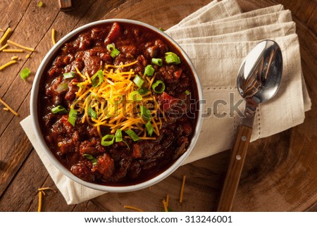 Homemade Organic Vegetarian Chili with Beans and Cheese Royalty-Free Stock Photo #313246001