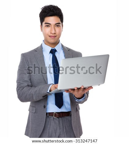 Asian businessman use of the notebook computer