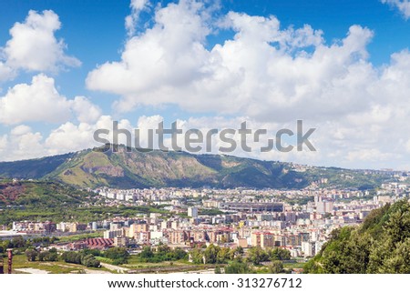 Naples cityscape with modern city part and Stadio San Paolo stadium under blue cloudy sky