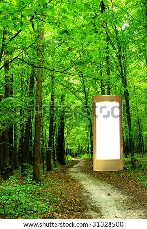 advertising billboard in green forest