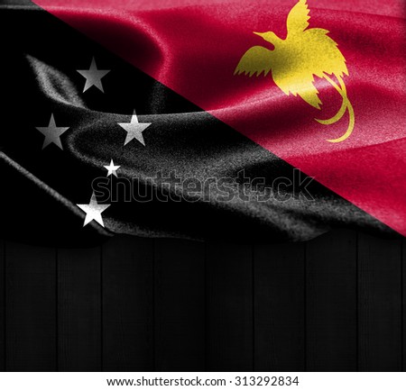 Papua New Guinea flag on wood Texture