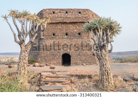 This  blockhouse on a hill guarded Prieska, a small town next to the Gariep River, during the Second Boer War. It was built from semi-precious tigers eye stones Royalty-Free Stock Photo #313400321