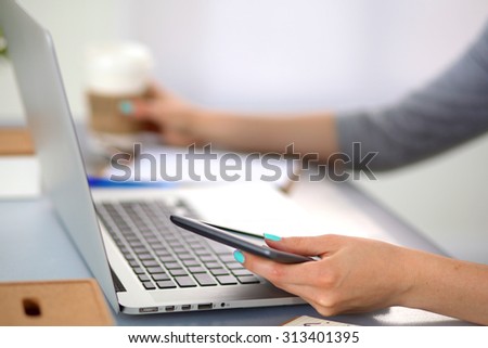 Young businesswoman working on a laptop