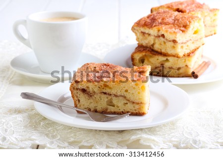 Cinnamon sour cream coffee cake on plate Royalty-Free Stock Photo #313412456