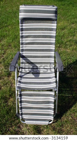 Nice deck chair on a grass