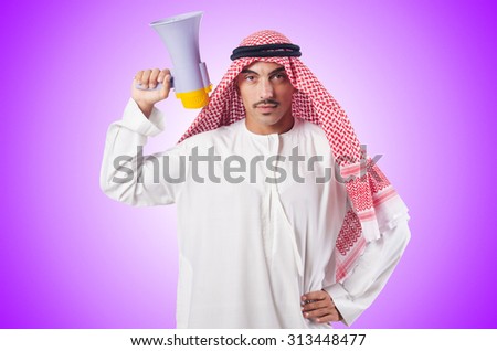 Arab man shouting through loudspeaker Royalty-Free Stock Photo #313448477