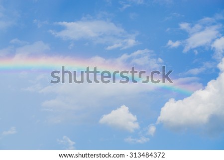 Blue sky and white cloud with sun light and rainbow