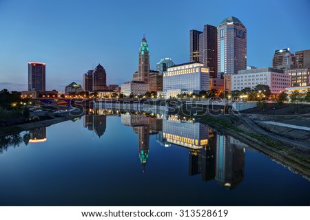 Scioto River and Columbus Ohio skyline at John W. Galbreath Bicentennial Park at dusk Royalty-Free Stock Photo #313528619