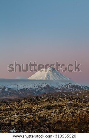 Ngauruhoe mountain/volcano south of Lake Taupo, New Zealand. This perfect cone volcano is lovely within the Tongariro National Park. A winter view just at sunset. Great for many different ideas.