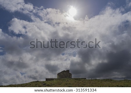 House and clouds.