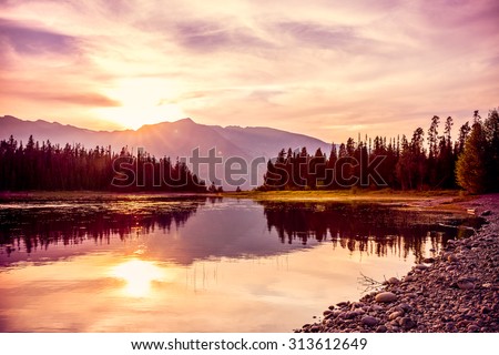 Grand Teton mountain range at sunset, Jackson Lake, Grand Teton National Park, wyoming, USA Royalty-Free Stock Photo #313612649