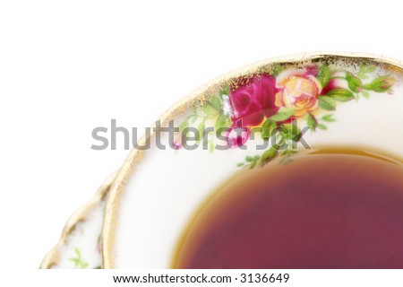 A cup of black tea in a classic, gold-rimmed floral china teacup. Royalty-Free Stock Photo #3136649