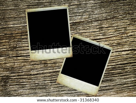 two blank photos on vintage wood texture background