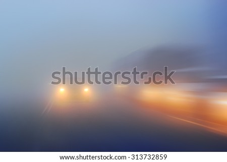 blurred background traffic jams foggy night Royalty-Free Stock Photo #313732859