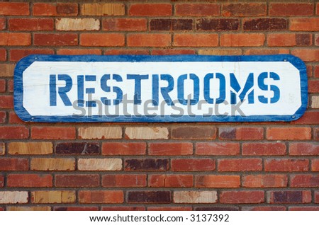 stenciled restroom sign