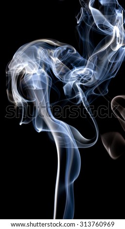 Colorful smoke abstract curly on black background