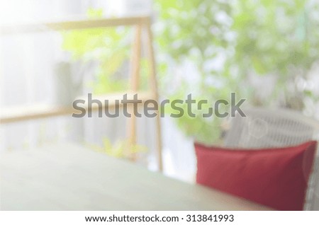 Blur table working space in coffee shop abstract background.