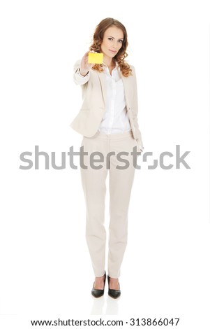 Happy businesswoman holding blank card.
