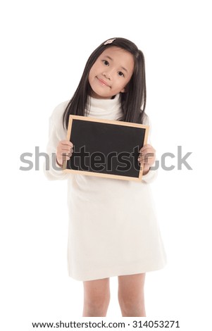 Cute asian girl in white turtleneck dress holding blackboard on white background isolated