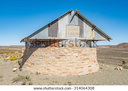 The blockhouse on Koeelkop (bullet hill) in Carnavon in the Northern Cape Karoo region was was used by the English forces to guard over the town during the Second Anglo Boer War Royalty-Free Stock Photo #314064308