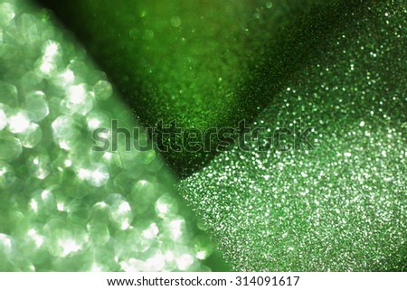 Elegant abstract background with bokeh defocused lights. Green glitter background. 