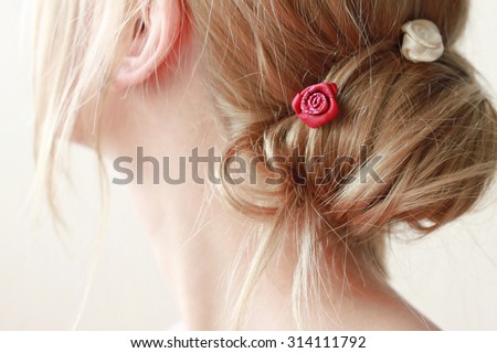 Delicate woman no-face blond hair bun very soft tender focus Royalty-Free Stock Photo #314111792