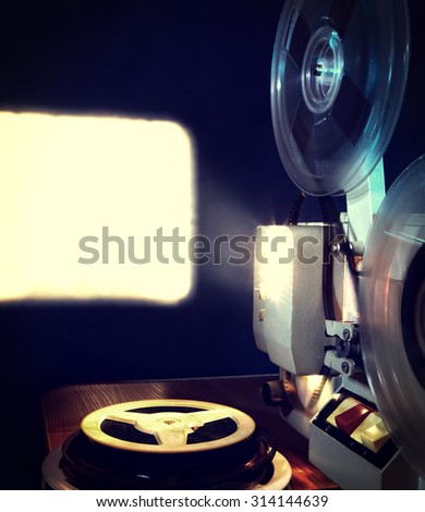 Toned Photo of the Old Film Projector in the Dark Room