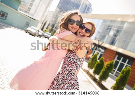 two girls friends laughing and hugging. hug and smile outdoor Royalty-Free Stock Photo #314145008