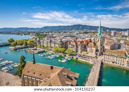 Aerial view of historic Zurich city center with famous Fraumunster Church and river Limmat at Lake Zurich from Grossmunster Church on a sunny day with clouds in summer, Canton of Zurich, Switzerland Royalty-Free Stock Photo #314150237