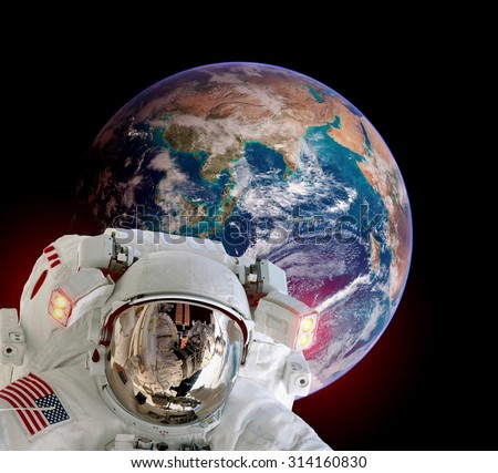Astronaut spaceman isolated helmet outer space planet earth globe. Elements of this image furnished by NASA.