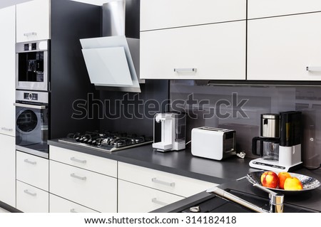 Modern luxury hi-tek black and white kitchen interior, clean design Royalty-Free Stock Photo #314182418