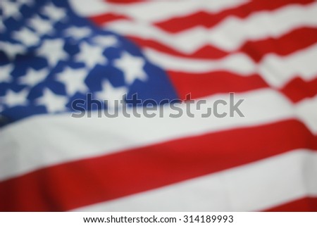 abstract blurred crumpled retro american flag with vignette background