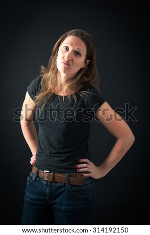 Beautiful woman doing different expressions in different sets of clothes: bored