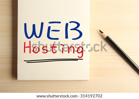 Text Web hosting with underline on the notebook with a pencil aside.