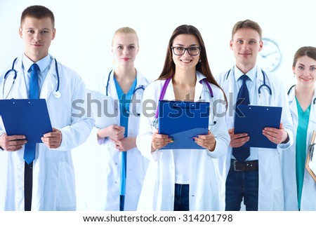 Portrait of group of smiling hospital colleagues standing together