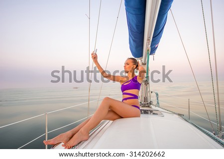 Girl makes selfie on the yacht. Model resting on the yacht. Travel by sea on a yacht.