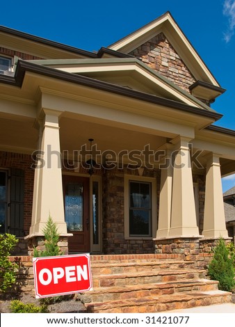 Luxury Model Home angled entrance with Open signage