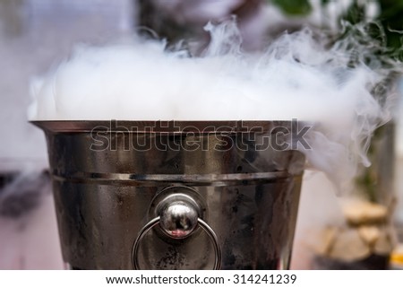 Extra cold bucket with vapor Royalty-Free Stock Photo #314241239