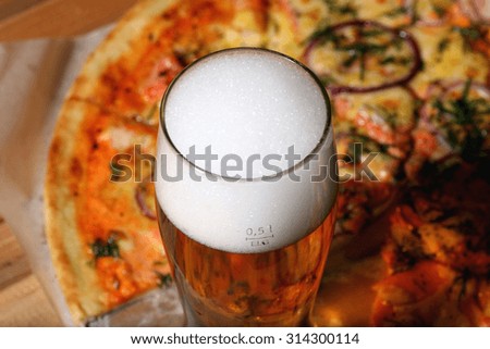 pizza and a glass of beer
