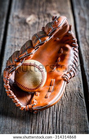 Closeup of old baseball glove and ball