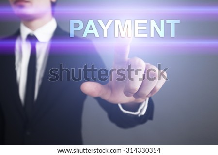 Businessman pressing touch screen interface and select "Payment". Business concept. Internet concept.