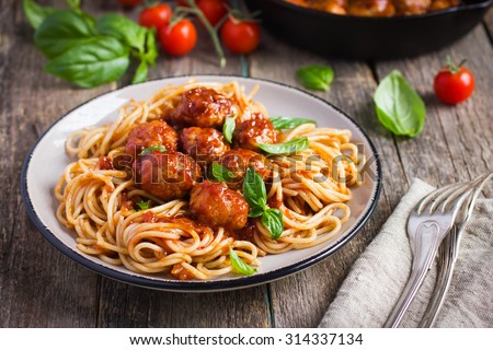 Spaghetti pasta  with meatballs and tomato sauce,  selective focus Royalty-Free Stock Photo #314337134